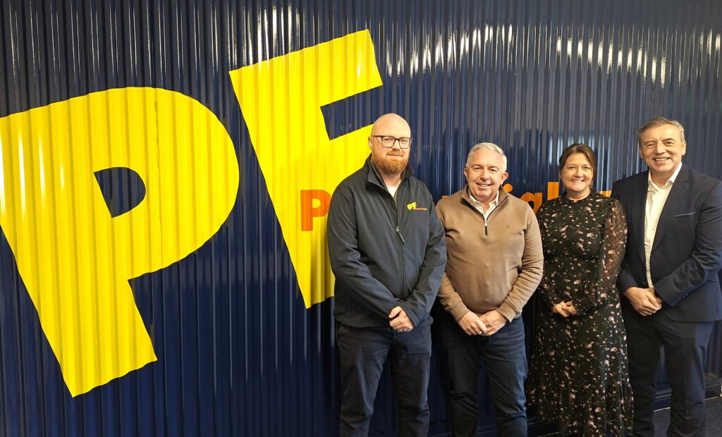 Members of Perennial Freight staff pose for a photo with FTA CEO, Niall Cotton